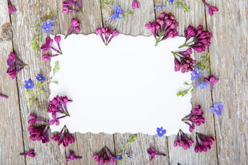 Flower arrangement on a wooden background. View from above.