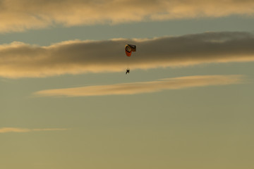 Motor trike hang glider flying in the sunset Malvern hills Worcestershire