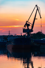 Fototapeta na wymiar tanker at docks at sunset
