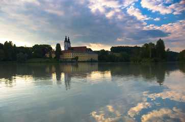 A view at Vornbach Abbey (Kloster Vornbach - Kirche Maria Himmelfahrt) over river Inn during the sunset