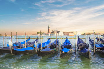 Fototapeta na wymiar Beautiful view of the gondolas and the Cathedral of San Giorgio Maggiore, on an island in the Venetian lagoon, Venice, Italy