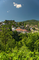 Overlooking city of Jajce from a nearby hill. A magnificent fortress is placed at the tom of a hill in the middle of the city, below are mosques and churches.