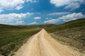 Fototapeta na wymiar An empty winding route through the Zelengora mountain range near Kalinovik, Bosnia and Herzegovina.