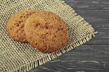 Homemade oatmeal cookies on wooden board