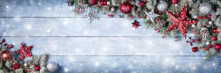 Christmas Ornament With Fir Branches On Snowy Wooden Plank
