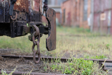 Narrow-gauge railway station in a small town. Wagons and locomotives on a siding in a railway workshop.