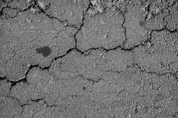 Asphalt road crack texture background for use. Cracks of concrete