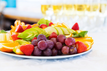 Party plate with fresh fruit cuts on table