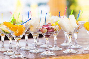 Cuts of fruits in glasses for party