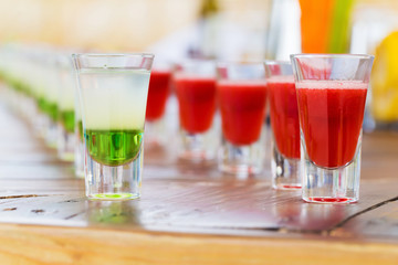 Row of shot drinks red and green