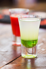 Row of shot drinks red and green