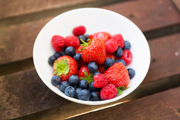 Fresh fruits berries blueberry strawberry raspberry in bowl