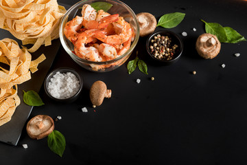 Fettuccine tagliatelle paste with prawns shrimps, herbs and spices