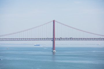 Beautiful panoramic view of 25th of April Suspension Bridge, 25 de Abril Bridge, over the Tagus river in Lisbon, Portugal