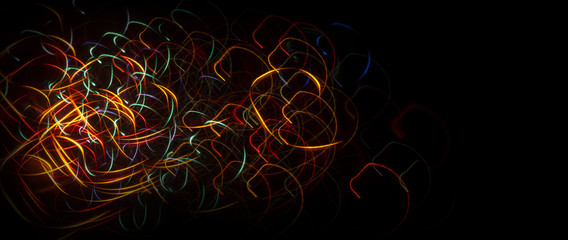 Neon sparks on a dark background. Abstract dark background.