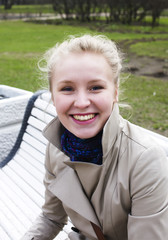 young pretty blonde girl enjoing spring nature in park, lifestyl