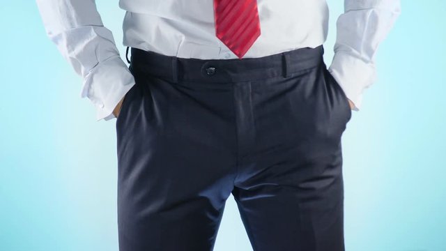 a person has problems with the genitourinary system. businessman on a colored background. 4k, close-up, slow-motion shooting.