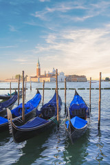 Fototapeta na wymiar Beautiful view of the gondolas and the Cathedral of San Giorgio Maggiore, on an island in the Venetian lagoon, Venice, Italy