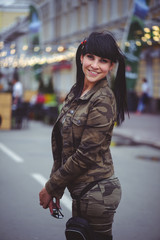 happy brunette woman outdoors in the city