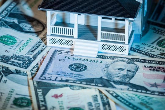 Model of a House on Money - Close Up