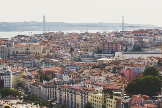 Beautiful super wide-angle aerial view of Lisbon, Portugal with harbor and skyline scenery beyond the city, shot from  belvedere observation deck