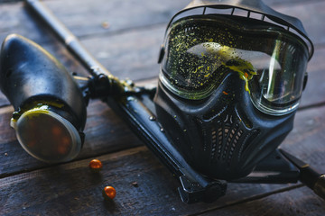 Special protective mask for playing paintball with traces and spot of hit of a ball with paint.  - obrazy, fototapety, plakaty