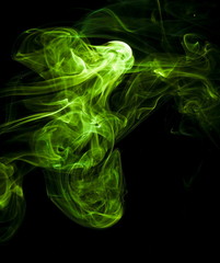 Green smoke on black background