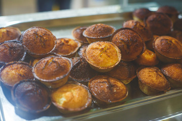Traditional Portuguese egg tart pasty cakes, dessert Pasteis de nata with different portuguese pastry on the cafe store window, pastel de nata