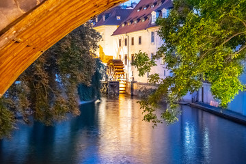 Certovka River and old Water mill under Charles Bridge, Lesser Town of Prague, Czech Republic.