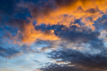 Naklejka na ściany i meble Clouds on sunset, dramatic sky