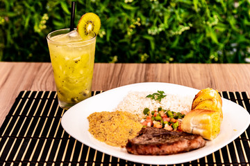 delicious dish of food and a delicious kiwi caipirinha
