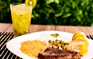 delicious dish of food and a delicious kiwi caipirinha