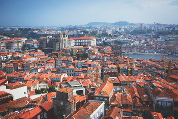 Fototapeta premium Beautiful super wide-angle summer aerial view of Porto, Norte Portugal region, Portugal, with skyline and scenery beyond the old town, shot from the observation deck of Clerigos church tower