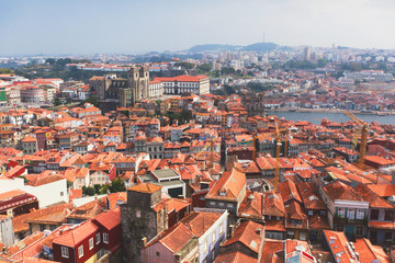 Naklejka na ściany i meble Beautiful super wide-angle summer aerial view of Porto, Norte Portugal region, Portugal, with skyline and scenery beyond the old town, shot from the observation deck of Clerigos church tower