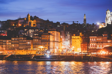 Obraz premium Beautiful super wide-angle panoramic summer aerial view of Old Porto Oporto city and Ribeira Square with the old town, during the sunset over Douro river from Vila Nova de Gaia, Porto, Portugal