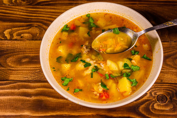 Georgian traditional food soup kharcho on wooden table. Top view