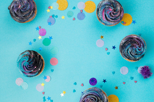 Vanilla cupcakes on party background with copy space