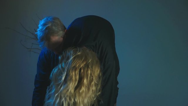 The zombie carries his victim on his shoulder. 4k, slow motion, Halloween concept