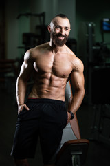 Fototapeta na wymiar Portrait Of Personal Trainer In Fitness Centar Gym