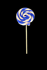 Sweet lollipop isolated on black background.