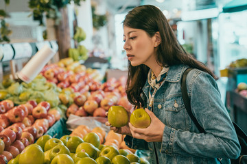 traveler buying fruits in original farmers market