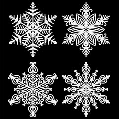 White Snowflakes - Set of 4 beautiful white snowflakes isolated on black background