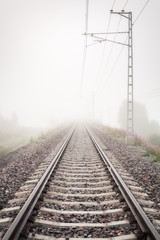 Fototapeta na wymiar Railroad in fog