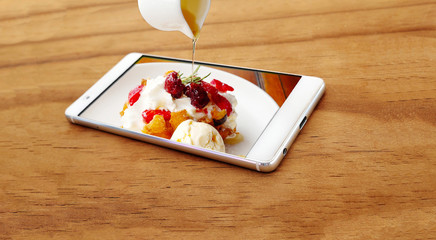 Waffle cream berry with ice cream on mobile phone