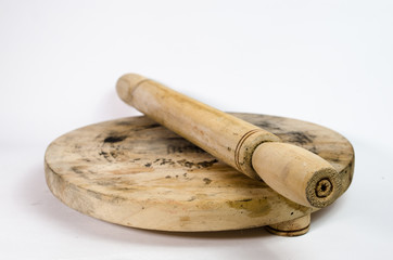 Rolling pin to knead flour, on a white isolated background