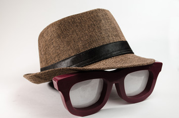 brown tone hat over a large lenses.