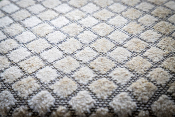 Fototapeta premium Gray fabric texture in a cage. Close up picture