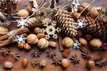 Decorative Christmas , nuts, cinnamon and anise stars.   Christmas time . Seasonal and holidays concept