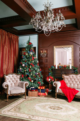Christmas evening. Gifts at the Christmas tree. Classic apartments with a fireplace.