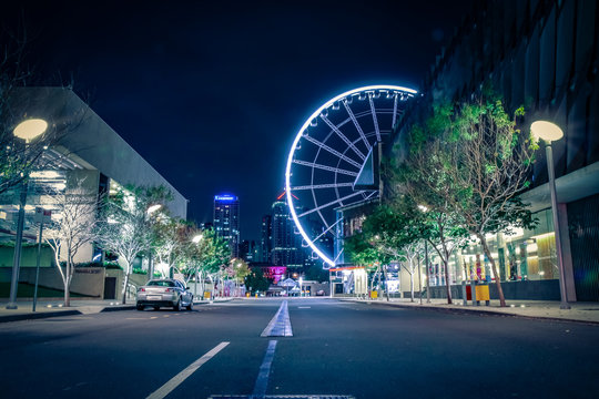 Big wheel in lights on dark street